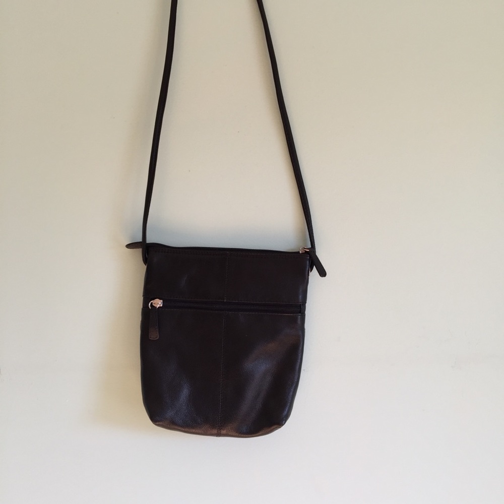 Black leather purse with red lining